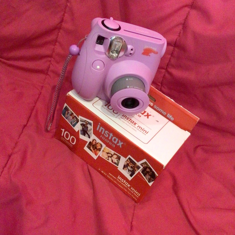 A polaroid camera, Come with 100 (Instax FUJIFILM Value pack)